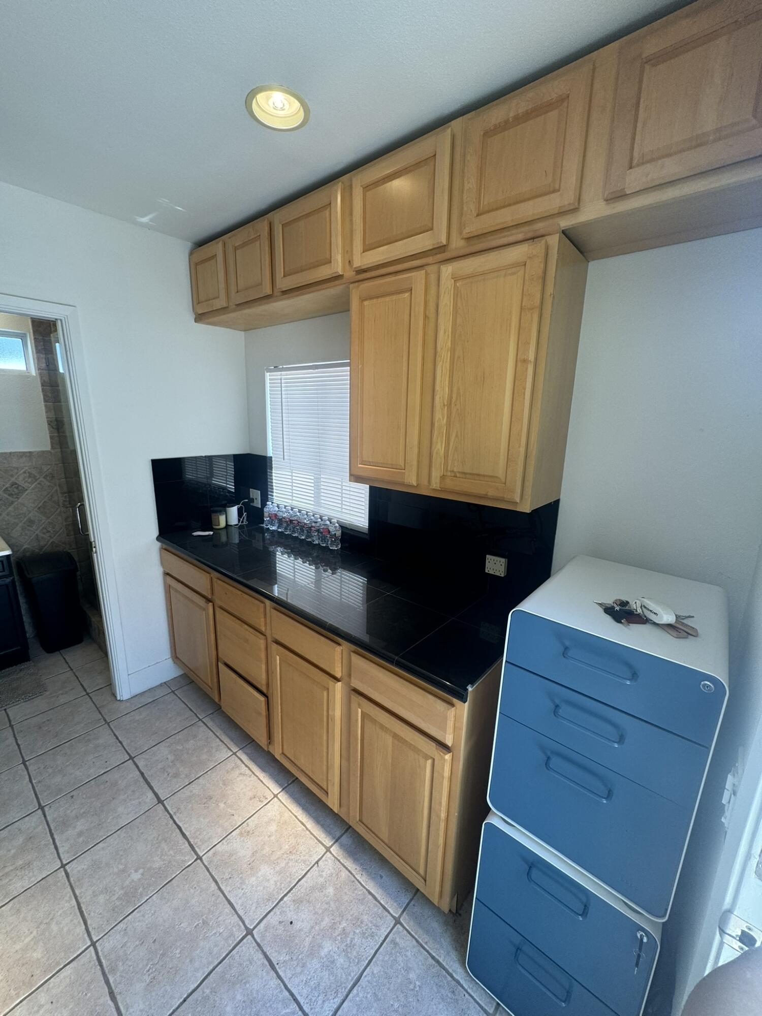 80501 Ave 48, Unit 110 Indio, CA 92201 - Photo 30 of 35 a kitchen with granite countertop a sink and a cabinets