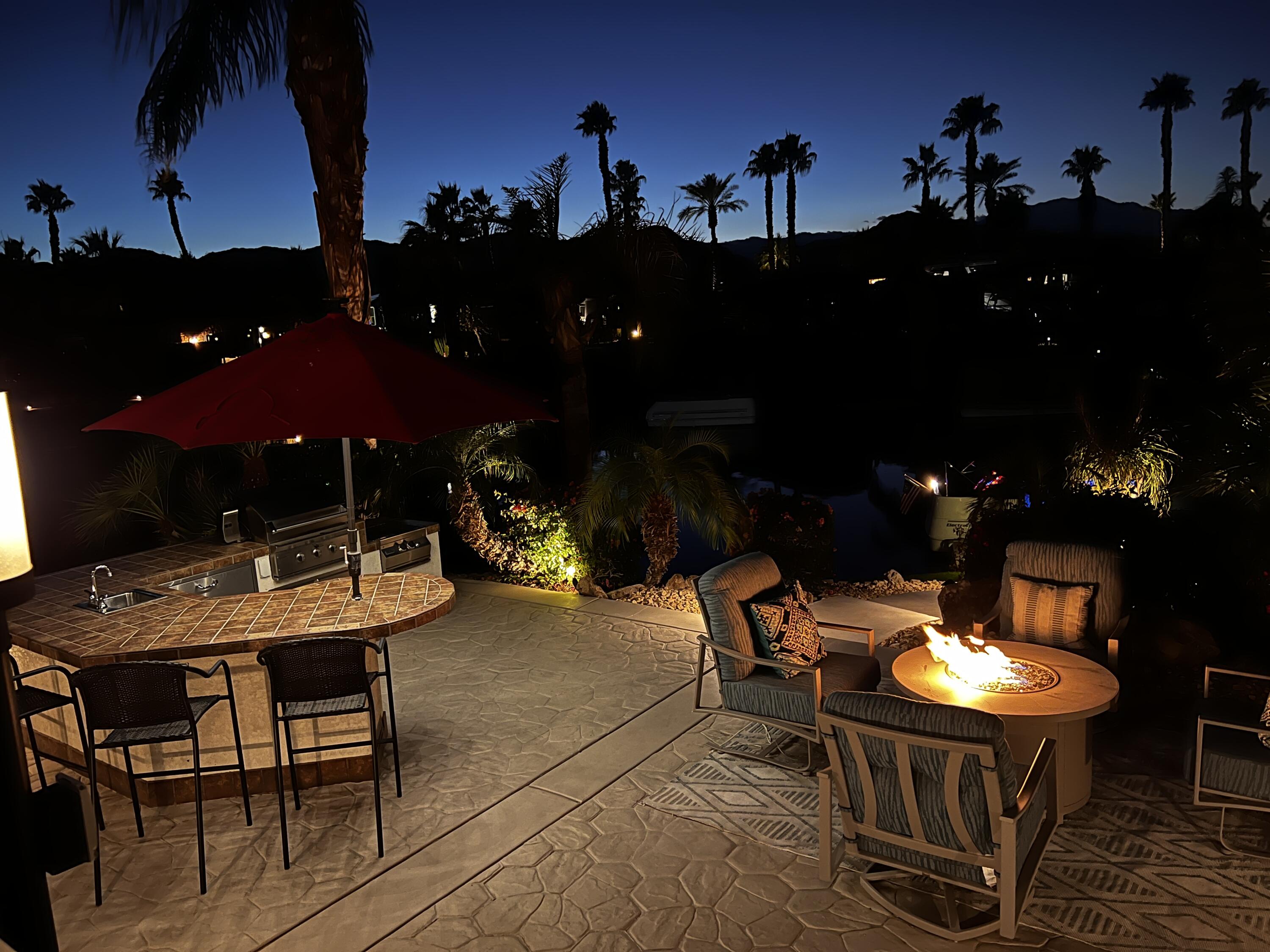 80501 Ave 48, Unit 110 Indio, CA 92201 - Photo 8 of 35 a backyard of a house with table and chairs