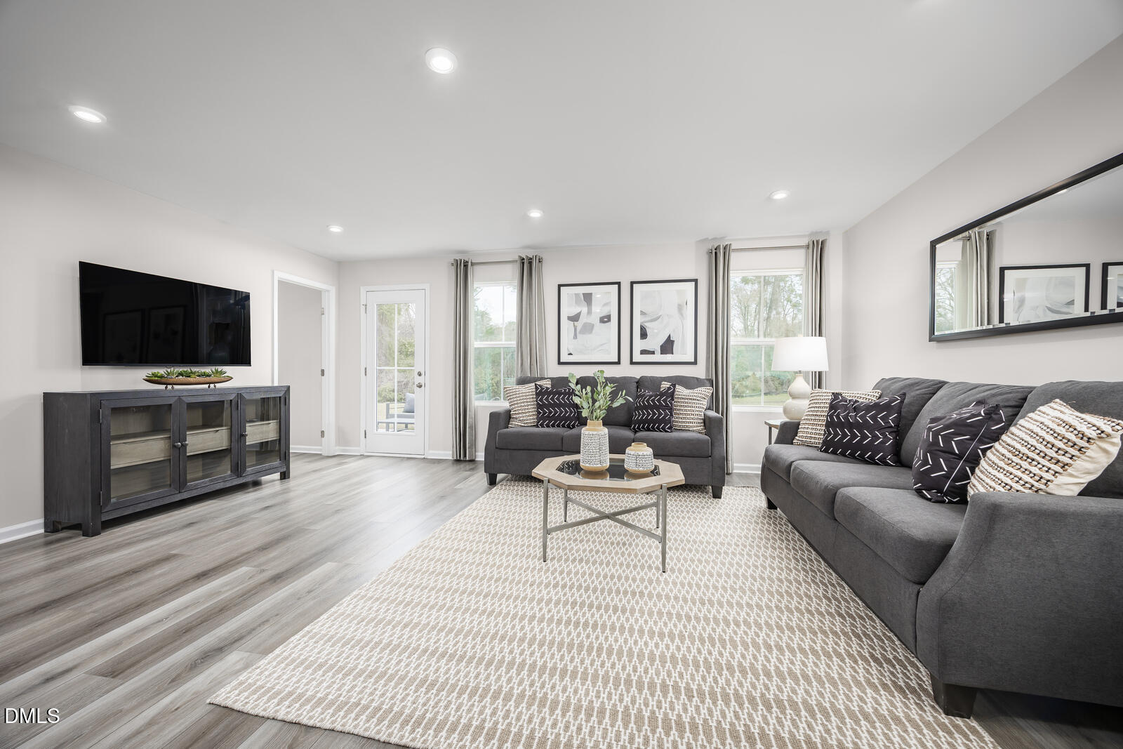 137 Cavalier Rider Run Wendell, NC 27591 - Photo 6 of 22 a living room with furniture and a flat screen tv