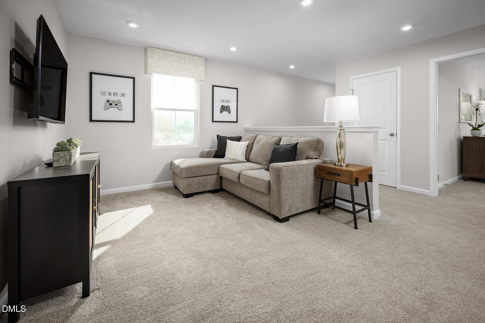 137 Cavalier Rider Run Wendell, NC 27591 - Photo 8 of 22 a living room with furniture and a flat screen tv