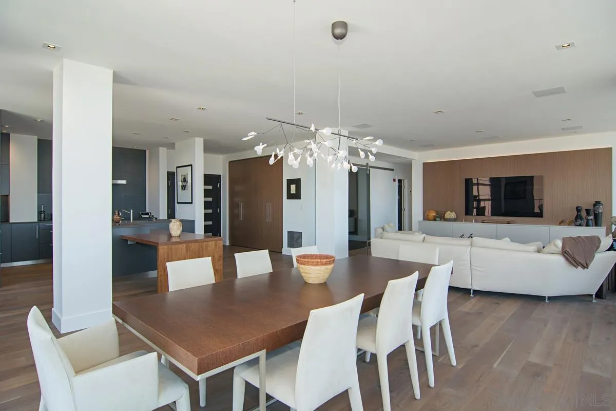 3634 7th Avenue, Unit 14H San Diego, CA 92103 - Photo 13 of 41 a view of a dining room with furniture and wooden floor