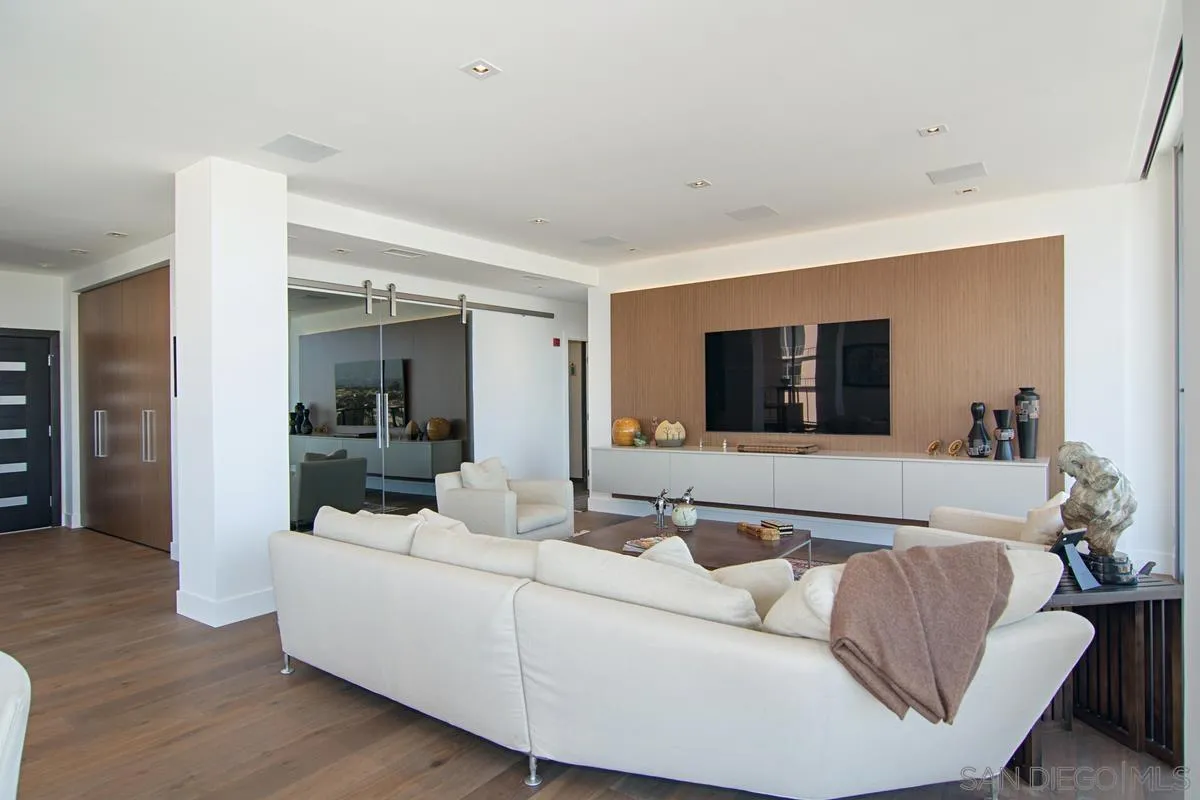 3634 7th Avenue, Unit 14H San Diego, CA 92103 - Photo 14 of 41 a living room with furniture and a flat screen tv