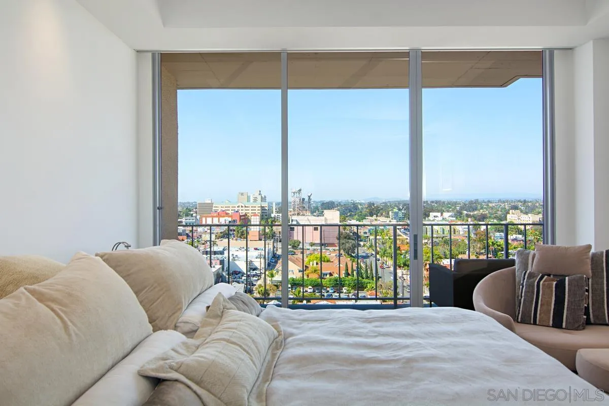 3634 7th Avenue, Unit 14H San Diego, CA 92103 - Photo 16 of 41 a living room with furniture and a large window