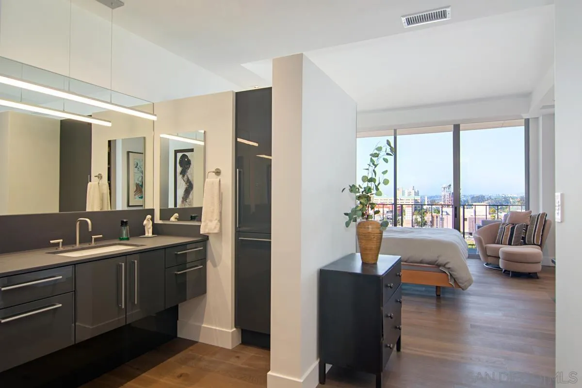 3634 7th Avenue, Unit 14H San Diego, CA 92103 - Photo 19 of 41 a living room with furniture and a large window