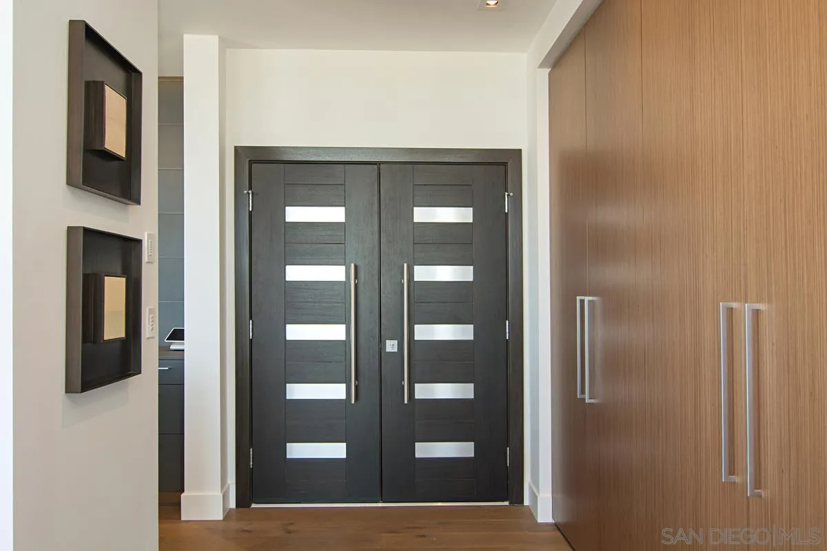 3634 7th Avenue, Unit 14H San Diego, CA 92103 - Photo 2 of 41 a view of a hallway with wooden floor
