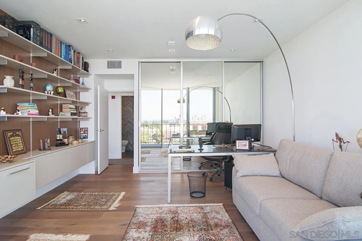 3634 7th Avenue, Unit 14H San Diego, CA 92103 - Photo 22 of 41 a living room with furniture and a potted plant