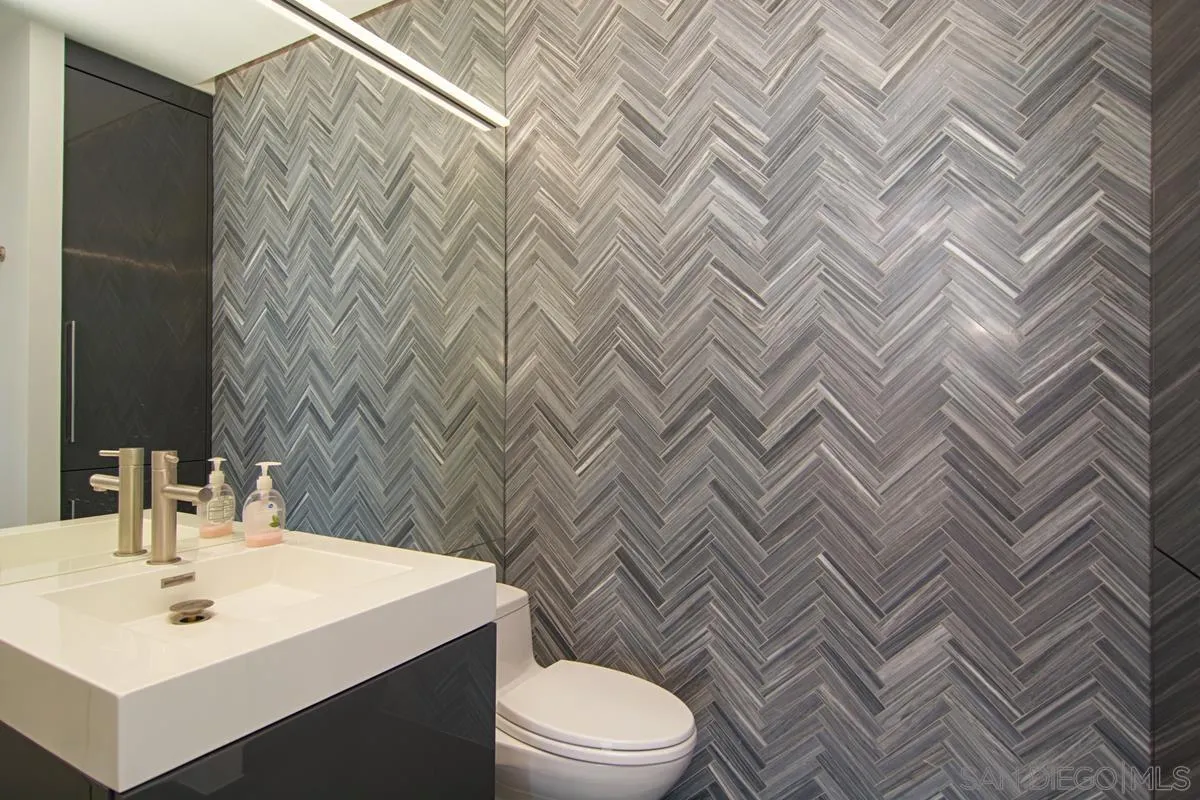 3634 7th Avenue, Unit 14H San Diego, CA 92103 - Photo 23 of 41 a bathroom with a sink toilet and mirror