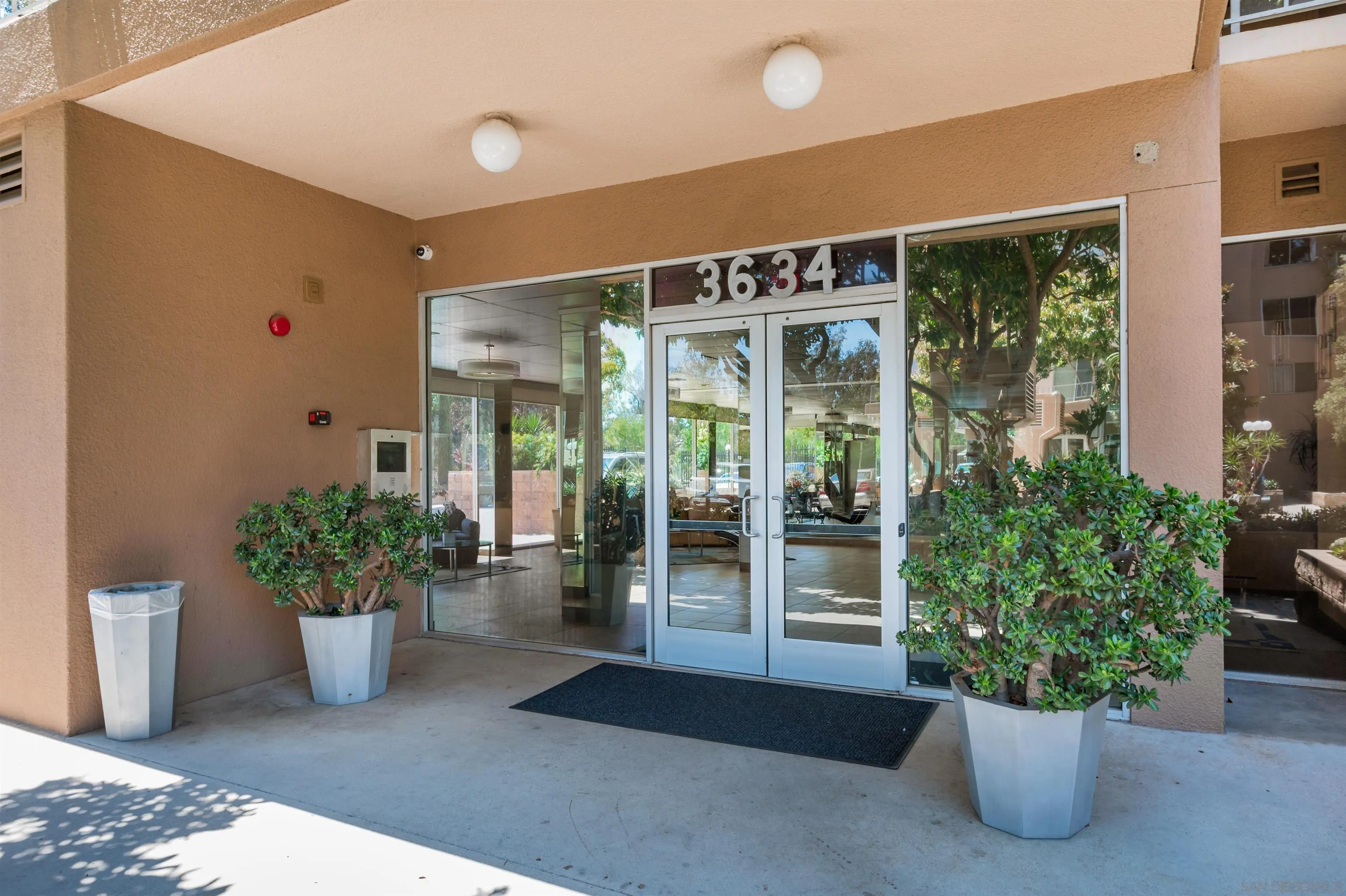 3634 7th Avenue, Unit 14H San Diego, CA 92103 - Photo 39 of 41 a potted plant sitting in front of a house