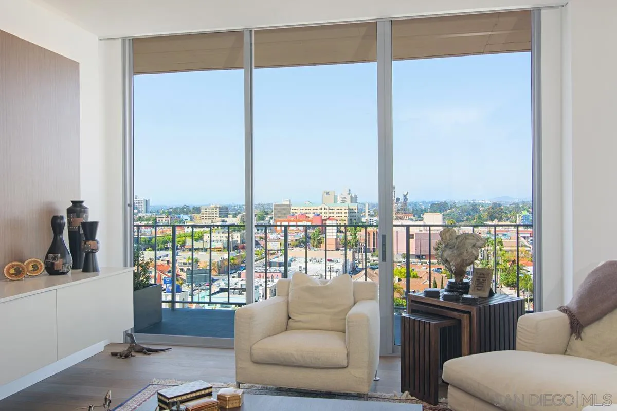 3634 7th Avenue, Unit 14H San Diego, CA 92103 - Photo 6 of 41 a living room with furniture and a floor to ceiling window