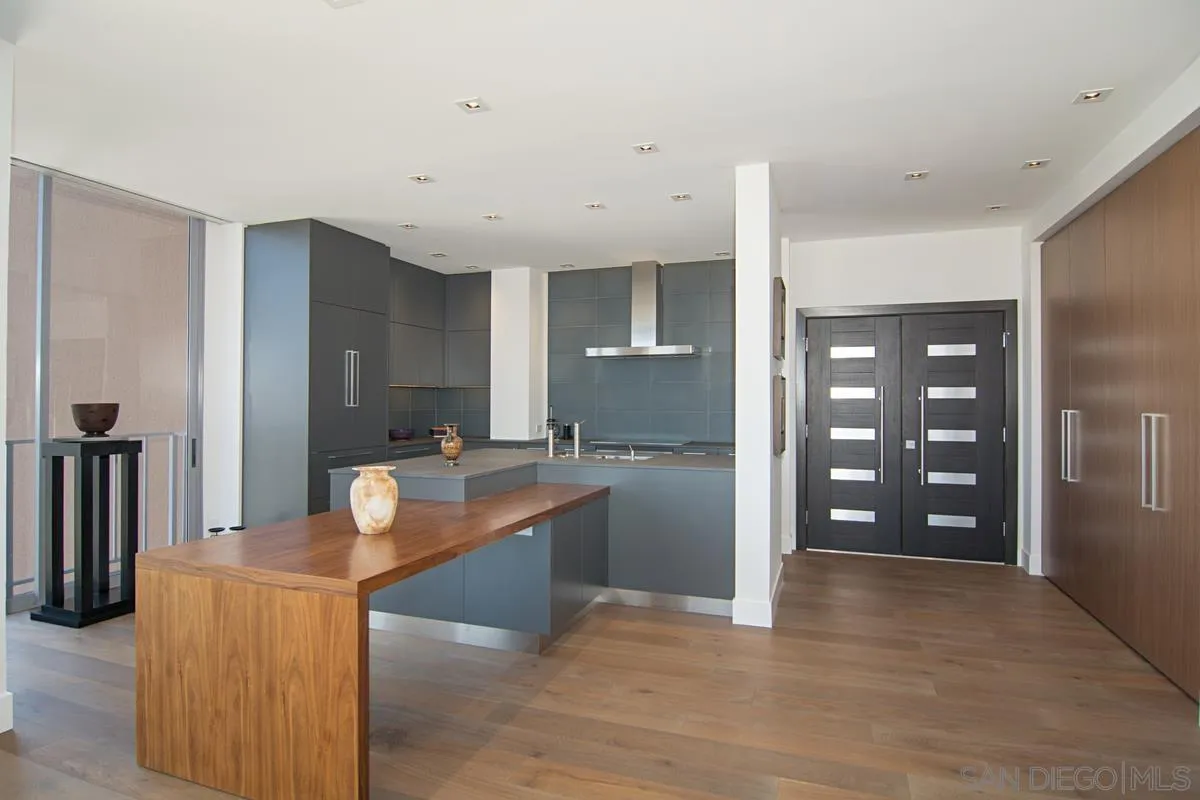 3634 7th Avenue, Unit 14H San Diego, CA 92103 - Photo 8 of 41 a room with wooden floor and furniture