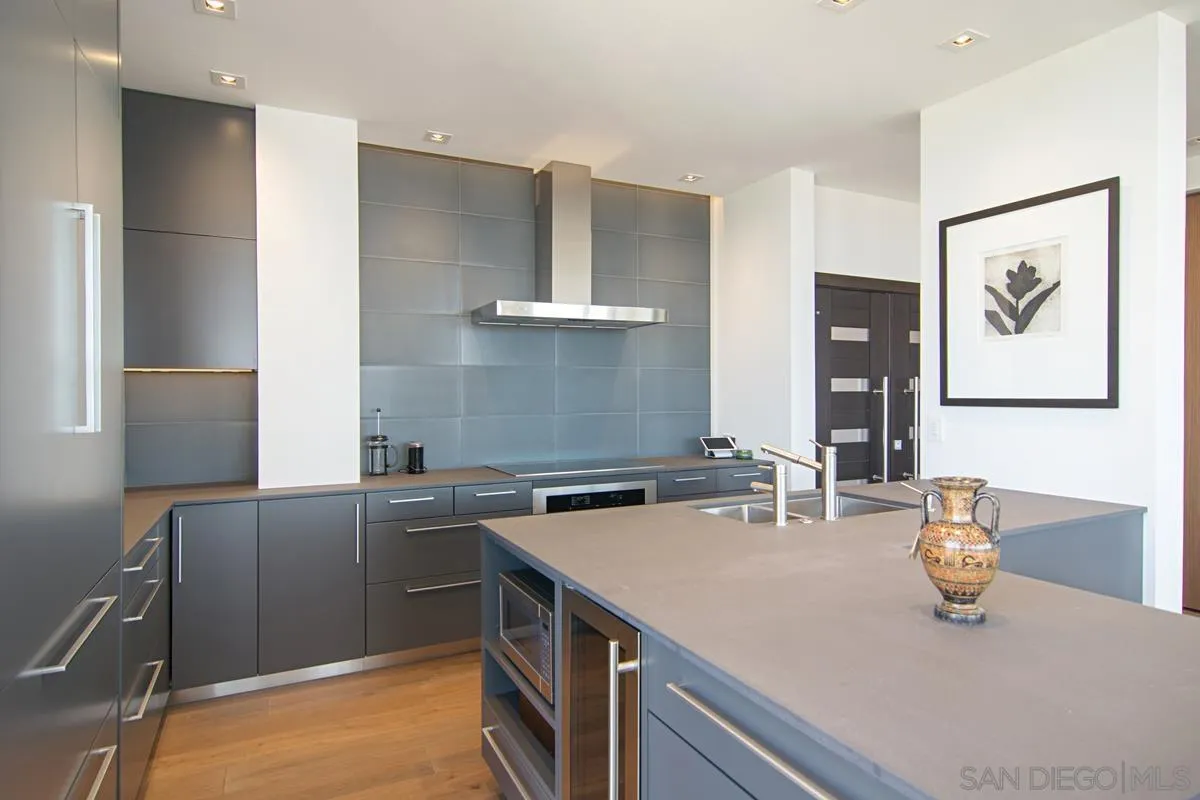 3634 7th Avenue, Unit 14H San Diego, CA 92103 - Photo 10 of 41 a kitchen with stainless steel appliances a sink and a stove