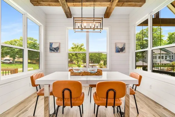 a kitchen with stainless steel appliances a stove a sink and a refrigerator