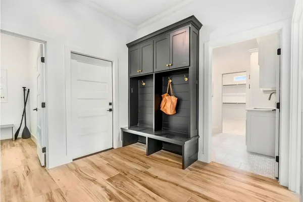 a kitchen with granite countertop white cabinets and white appliances