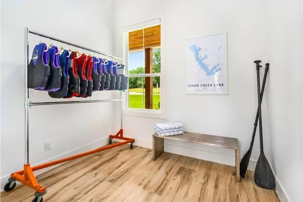 a living room with wooden floor and washing machine