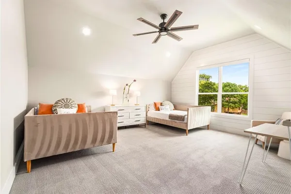 a bathroom with a granite countertop toilet a sink and a mirror