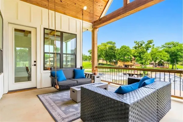 a large room with furniture and a bed