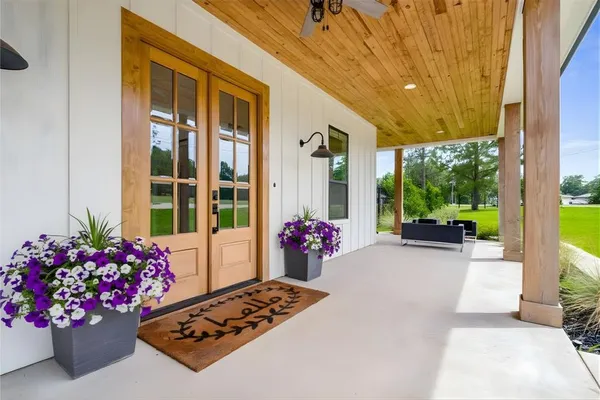a view of a front door and dining space