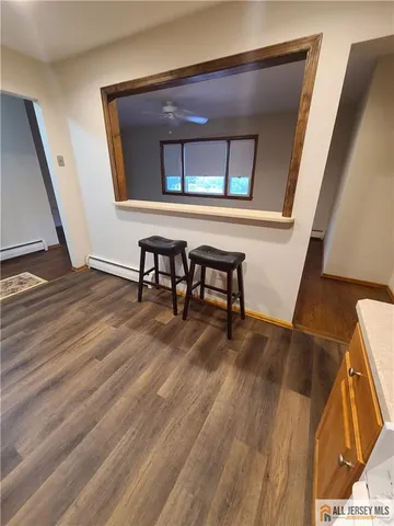 a view of a livingroom with furniture and wooden floor