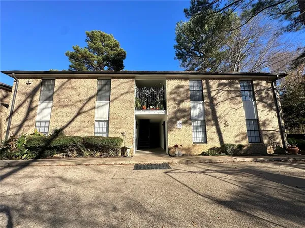 a view of a building with a tree
