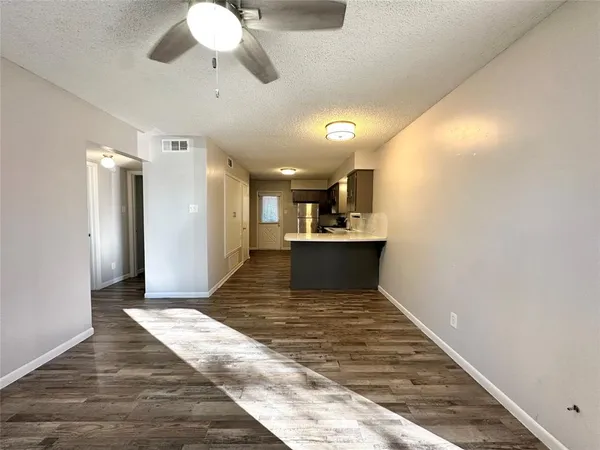 a view of kitchen with wooden floor