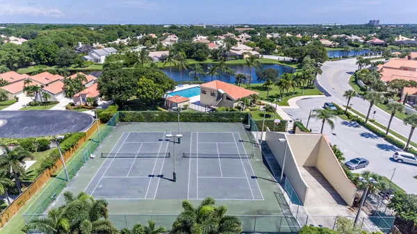 an aerial view of multiple houses with yard