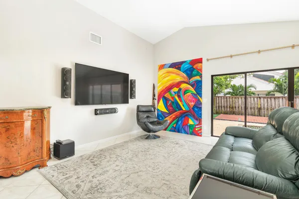 a living room with furniture and flat screen tv
