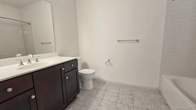 a view of a tennis ground with large trees