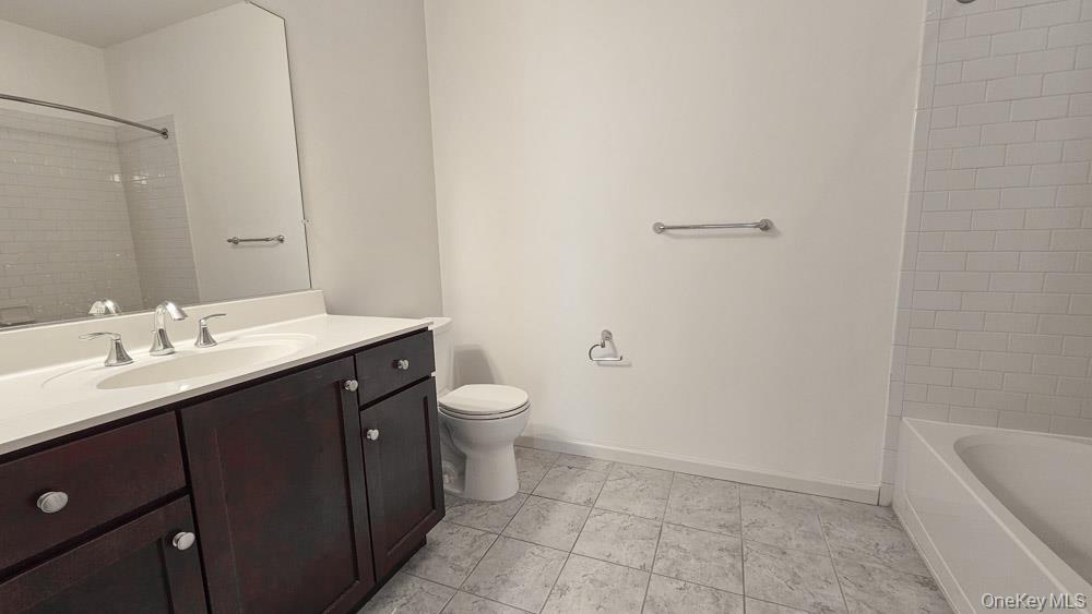 207 Center Street Goshen, NY 10924 - Photo 21 of 25 a bathroom with a sink a toilet and bathtub