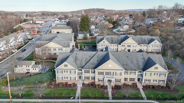 a picture of a wall with a table and chairs