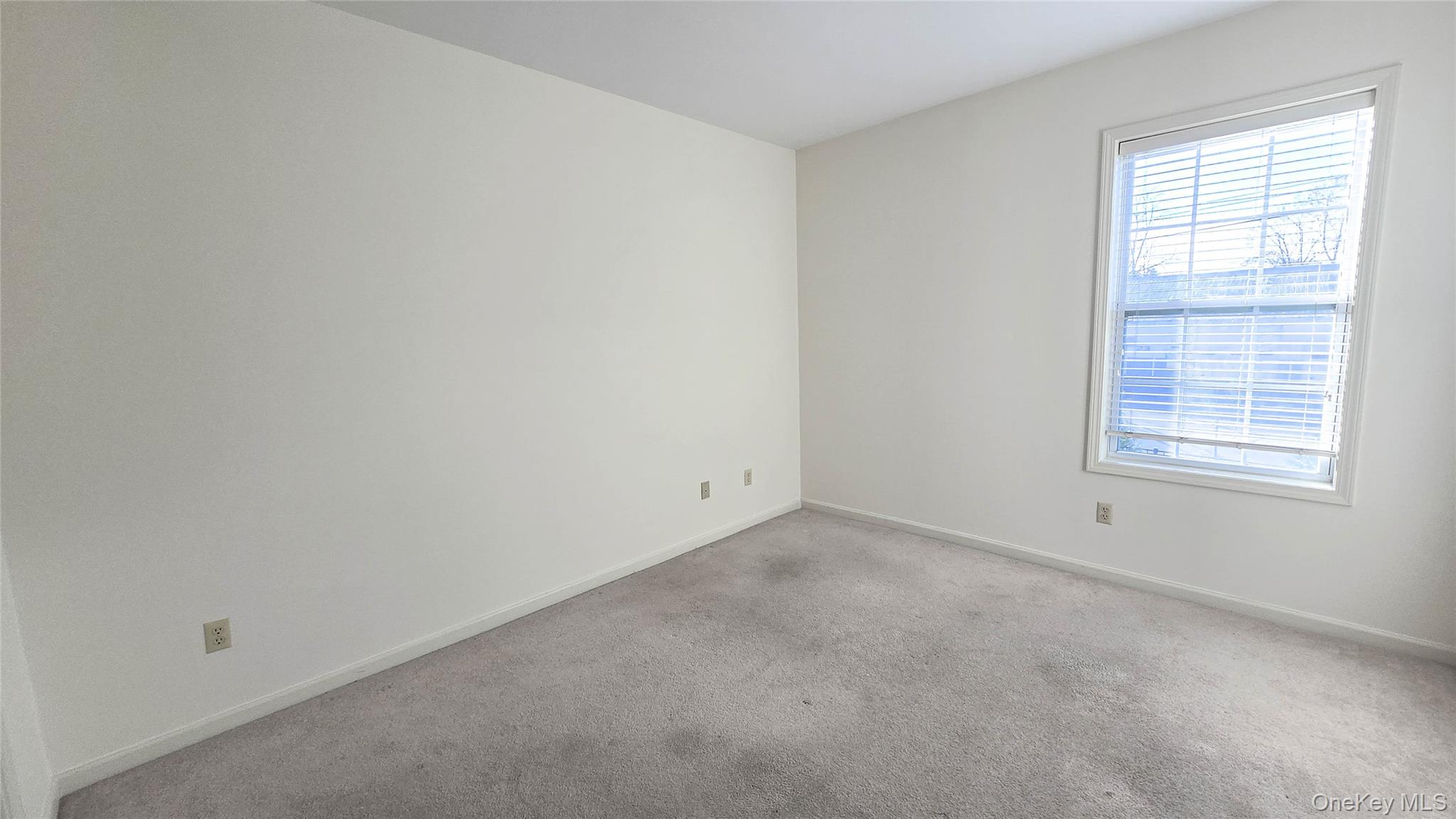 207 Center Street Goshen, NY 10924 - Photo 10 of 25 an empty room with a window