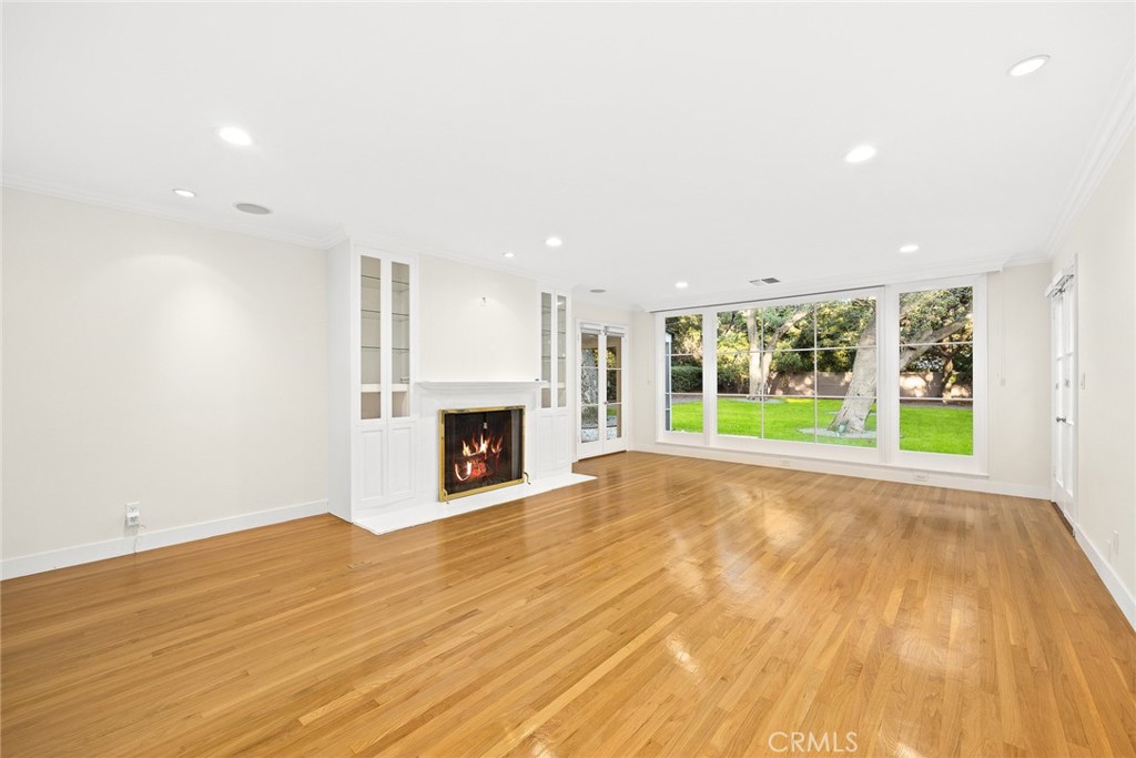 1300 Ramona Road Arcadia, CA 91006 - Photo 12 of 39 a view of empty room with wooden floor and fireplace