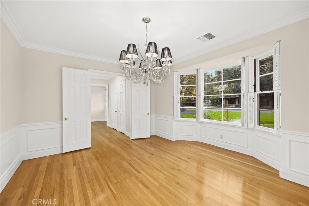 1300 Ramona Road Arcadia, CA 91006 - Photo 17 of 39 a view of empty room with wooden floor and windows