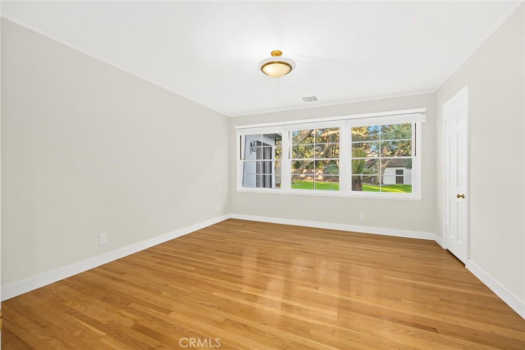 1300 Ramona Road Arcadia, CA 91006 - Photo 30 of 39 a view of an empty room with wooden floor and a window