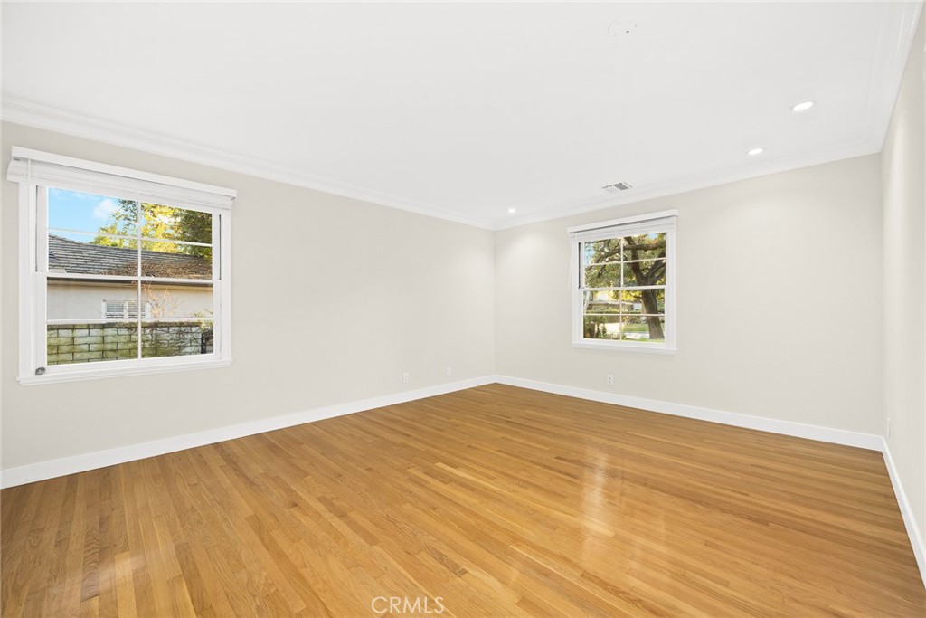 1300 Ramona Road Arcadia, CA 91006 - Photo 31 of 39 an empty room with wooden floor and windows
