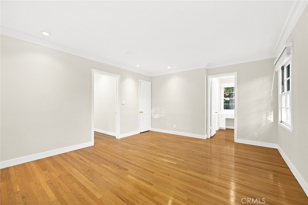 1300 Ramona Road Arcadia, CA 91006 - Photo 32 of 39 a view of an empty room with wooden floor and a window