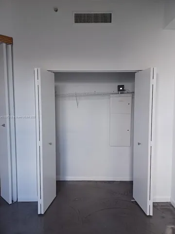 a white toilet and tub sitting next to a bathroom sink