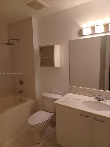a view of a hallway with washer and dryer