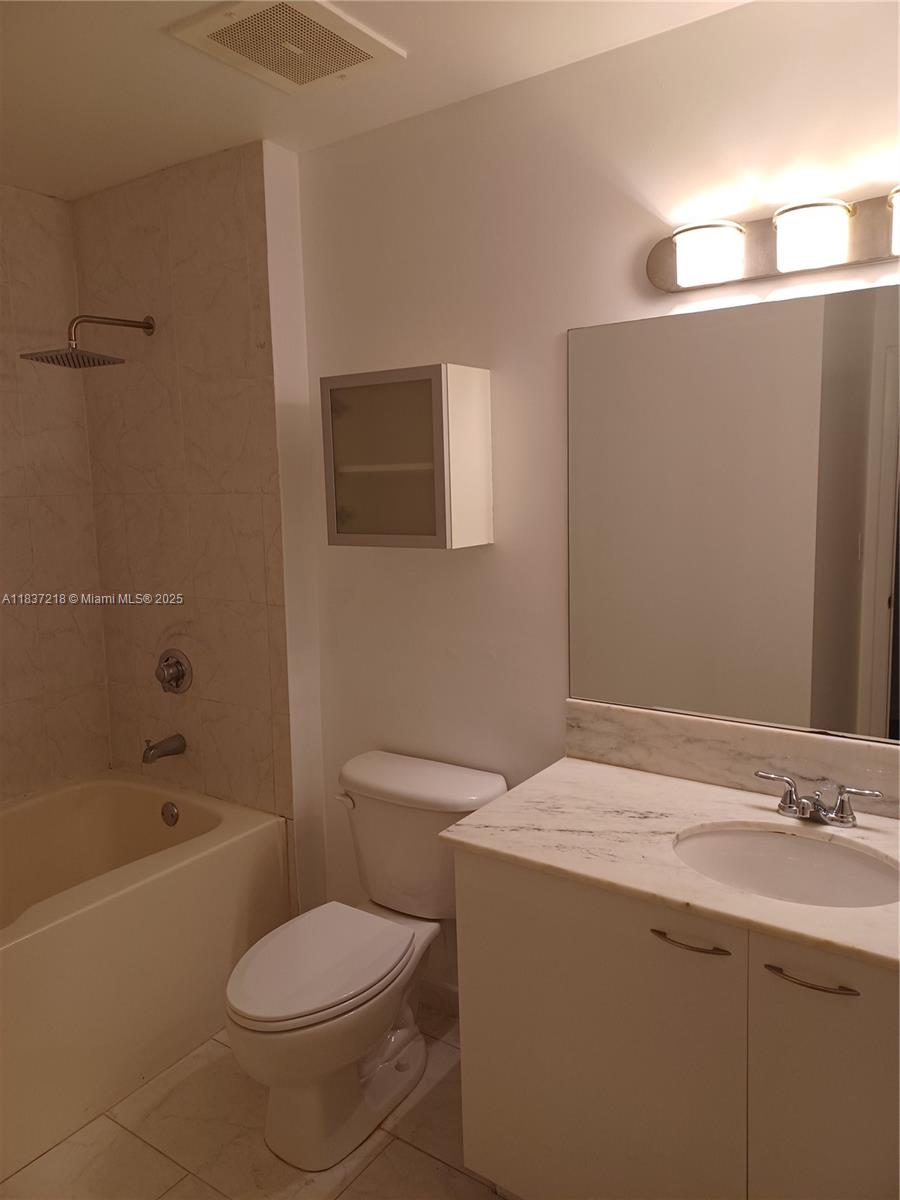 133 Northeast 2nd Avenue, Unit 412 Miami, FL 33132 - Photo 14 of 32 a bathroom with a sink toilet and shower
