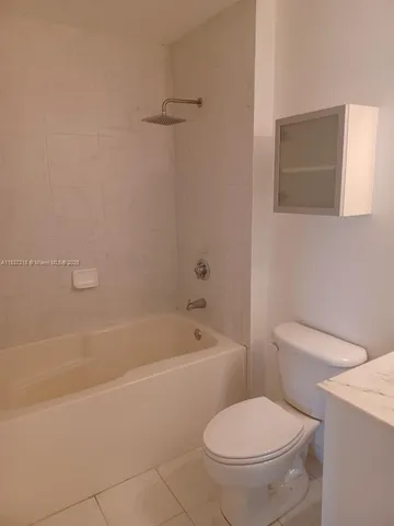 a view of storage and utility room with washer and dryer