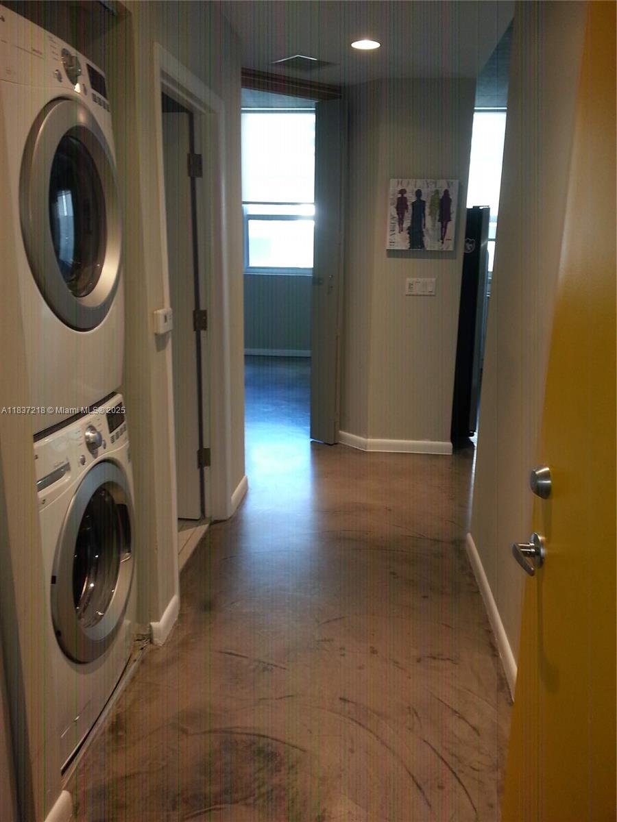 133 Northeast 2nd Avenue, Unit 412 Miami, FL 33132 - Photo 19 of 32 a view of a hallway with washer and dryer