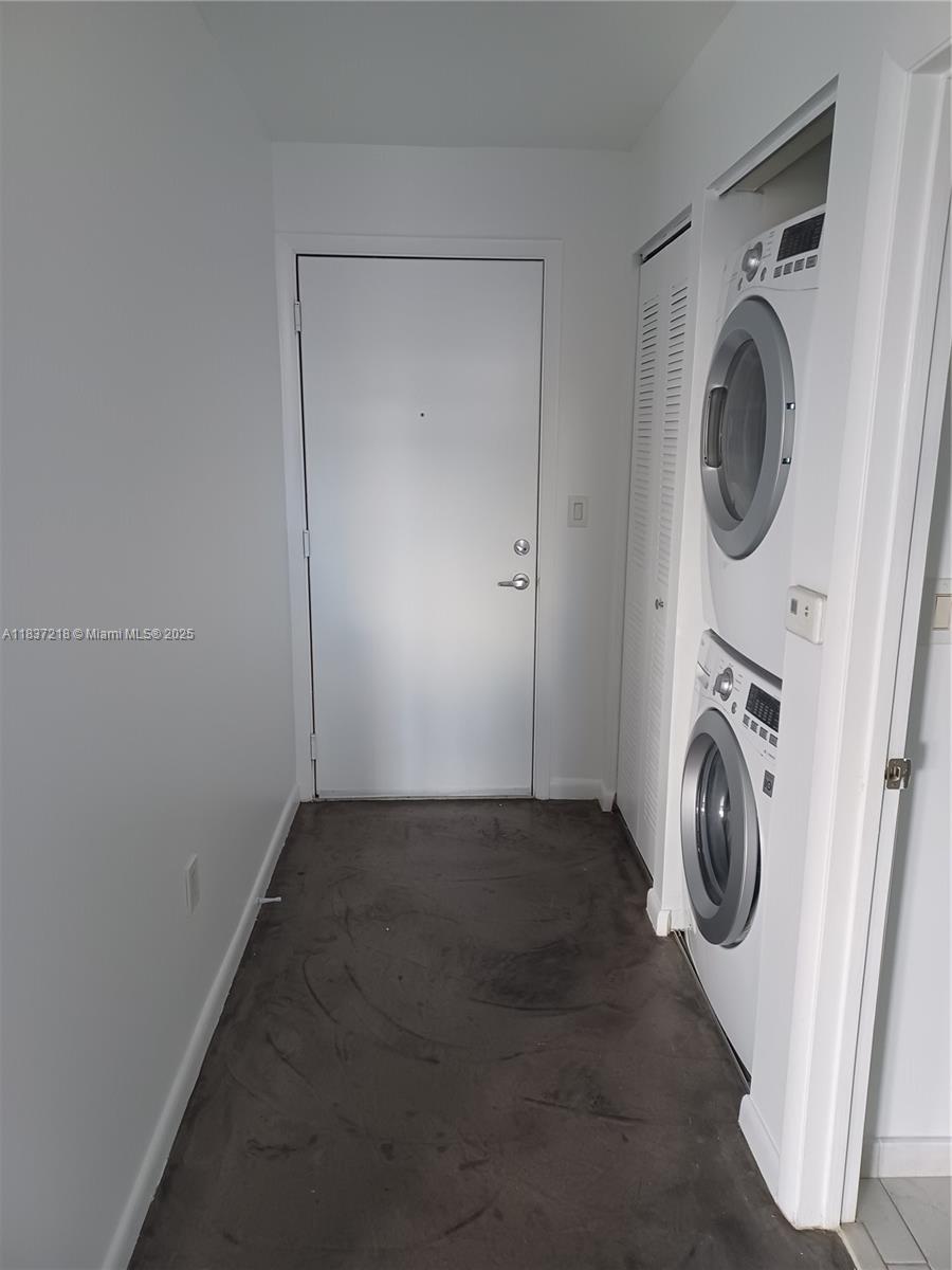 133 Northeast 2nd Avenue, Unit 412 Miami, FL 33132 - Photo 20 of 32 a view of storage and utility room with washer and dryer