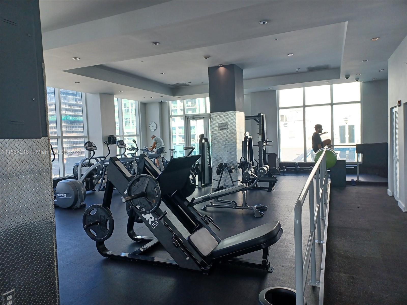 133 Northeast 2nd Avenue, Unit 412 Miami, FL 33132 - Photo 24 of 32 a view of a room with gym equipment