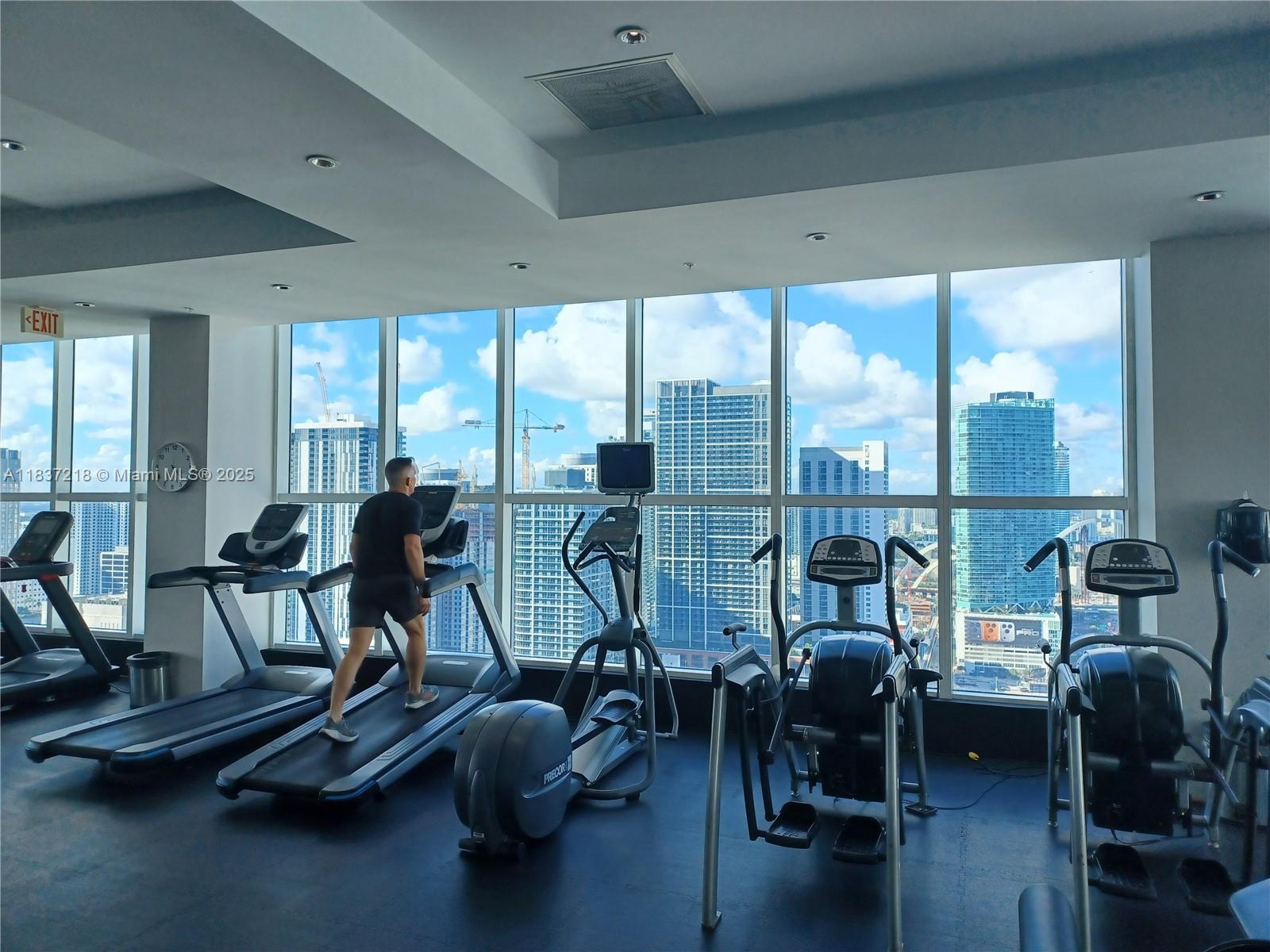 133 Northeast 2nd Avenue, Unit 412 Miami, FL 33132 - Photo 25 of 32 a view of a room with gym equipment