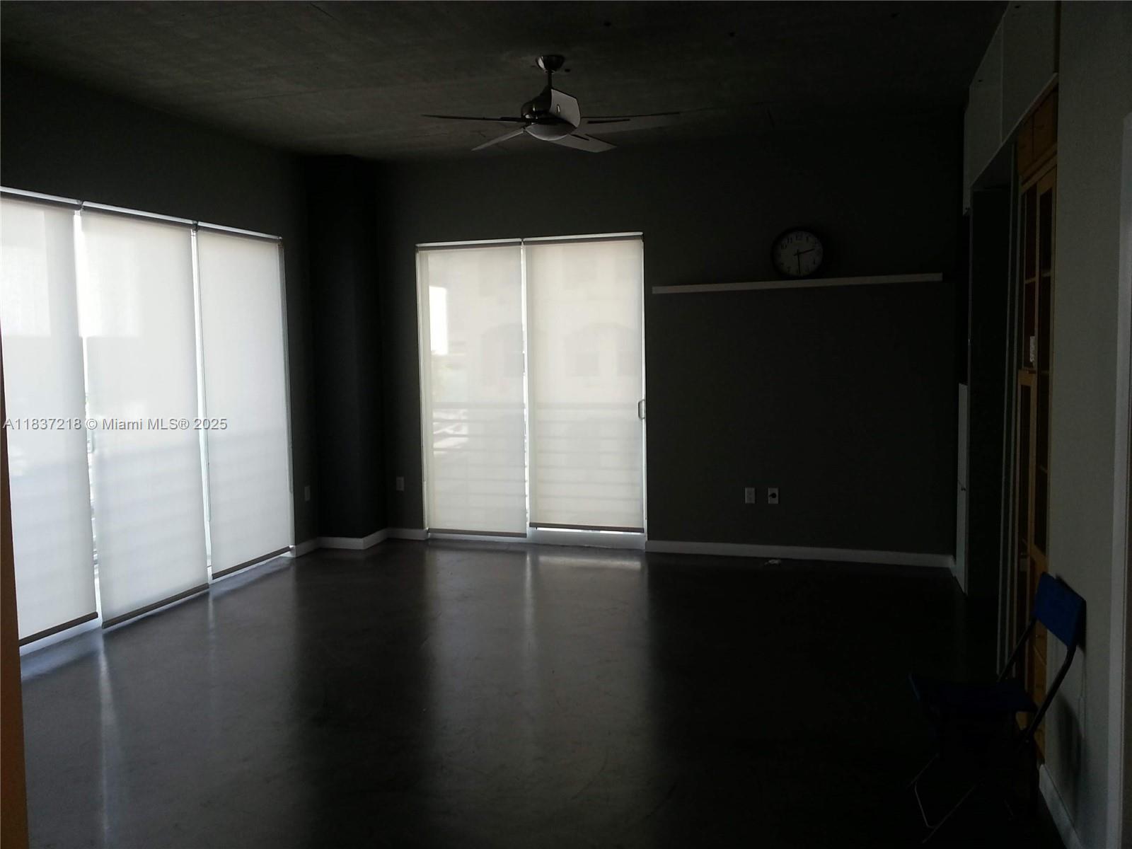 133 Northeast 2nd Avenue, Unit 412 Miami, FL 33132 - Photo 5 of 32 a view of an empty room with wooden floor