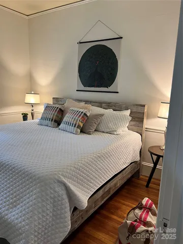 a bedroom with a bed and a fireplace