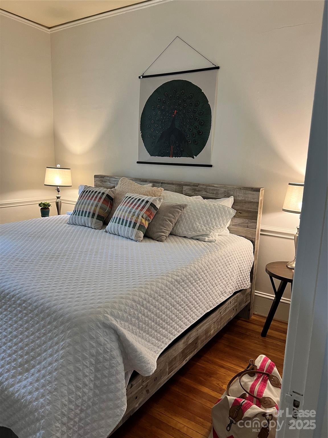 2615 Sharon Road Charlotte, NC 28211 - Photo 12 of 21 a bedroom with a bed and a fireplace