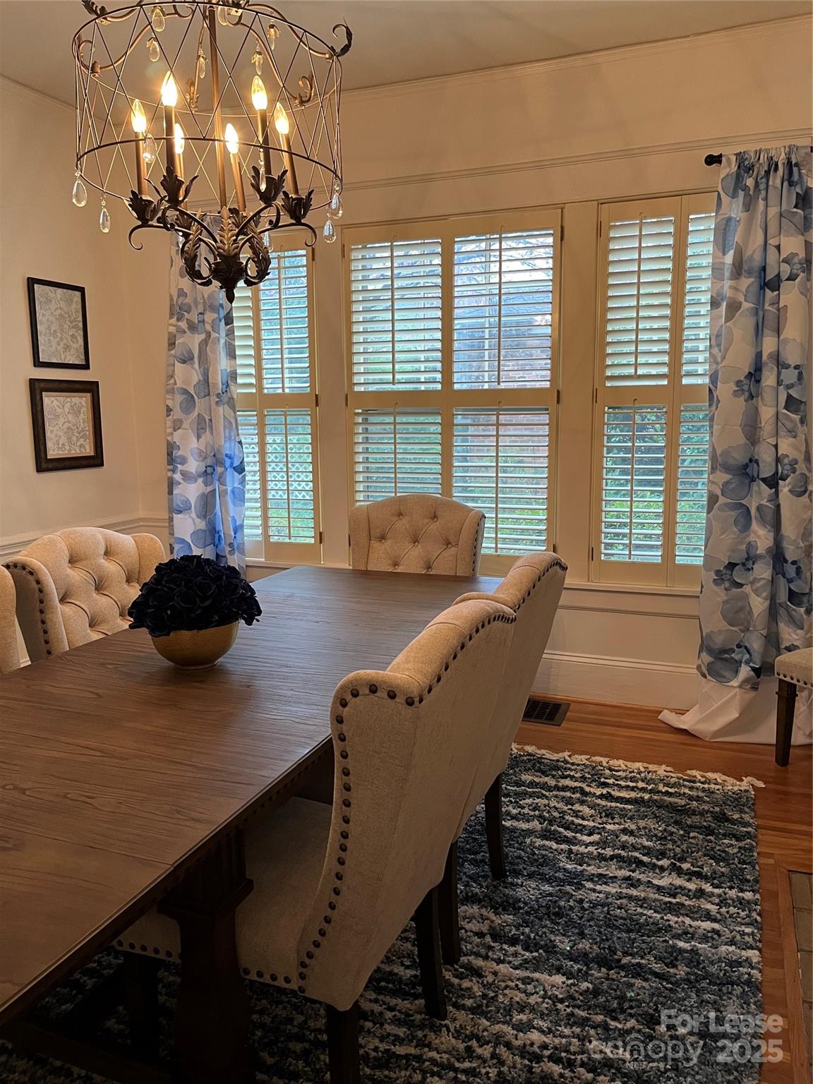 2615 Sharon Road Charlotte, NC 28211 - Photo 15 of 21 a living room with furniture and a chandelier