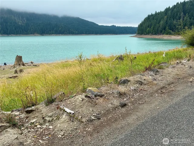 a view of a lake with a yard