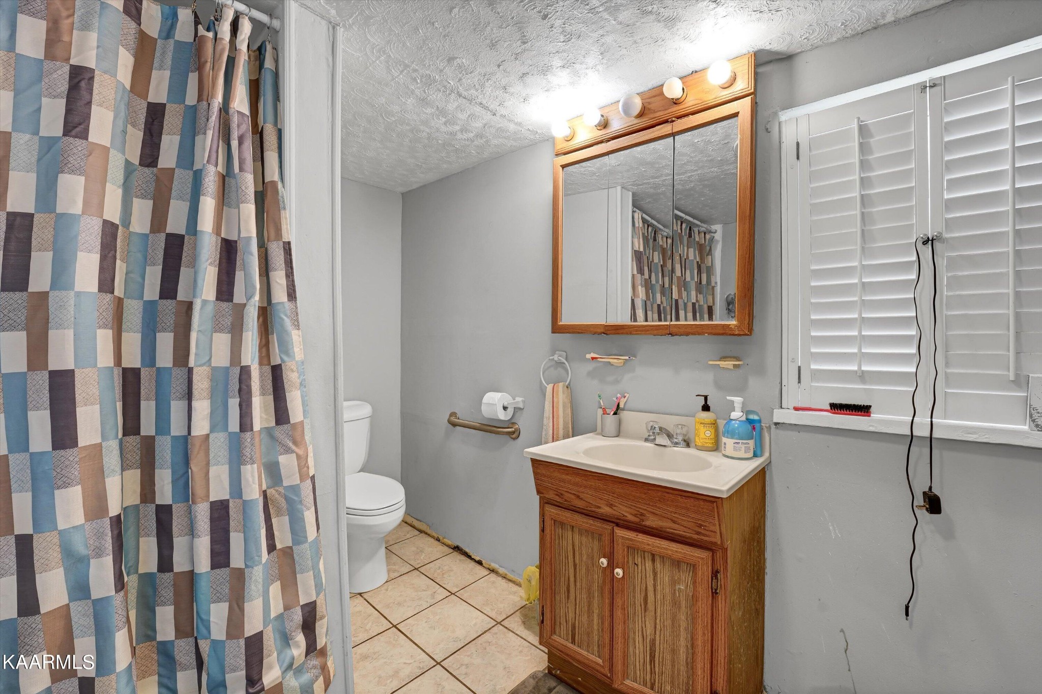 185 Moody Hollow Road Powell, TN 37849 - Photo 14 of 46 a bathroom with a sink and a mirror