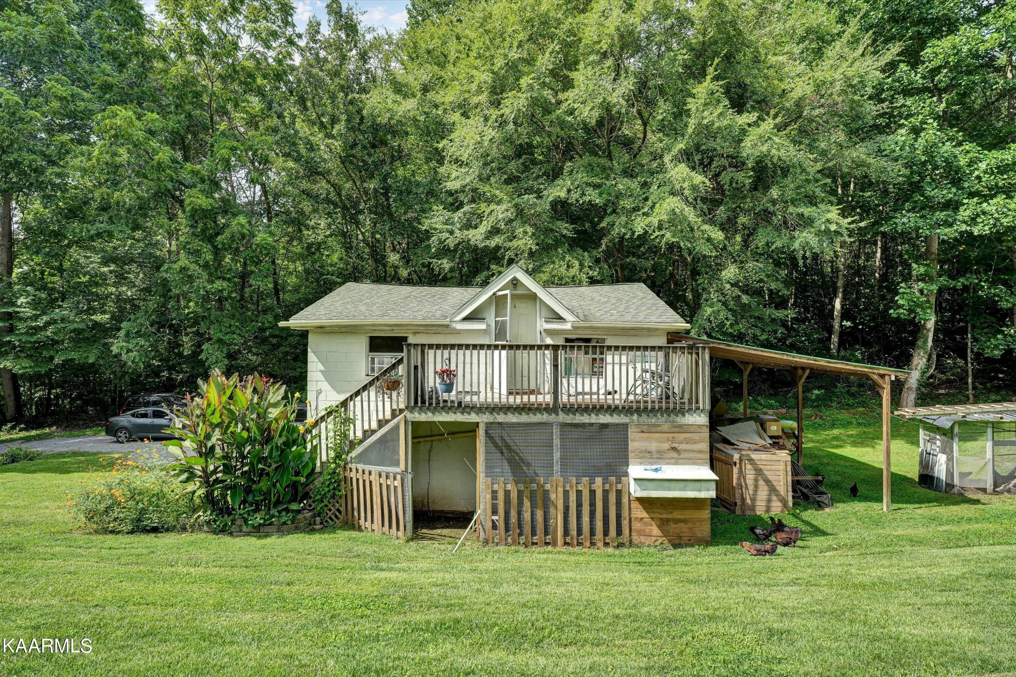 185 Moody Hollow Road Powell, TN 37849 - Photo 20 of 46 a front view of a house with garden